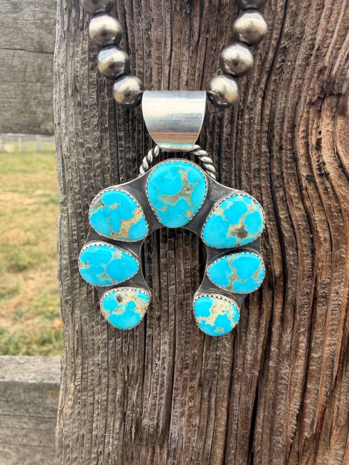 The Sierra squash blossom pendant