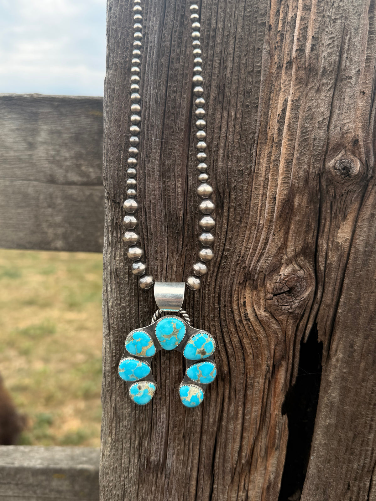 The Sierra squash blossom pendant